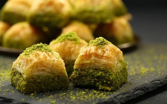 Pistachio baklava pieces with crushed pistachio