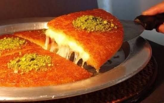 Hot kunefe with stretching cheese and pistachio